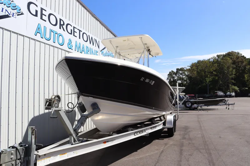 Slide: The Image of 2012 Cobia 256 CC boat on trailer at Georgetown Auto & Marine. - 2