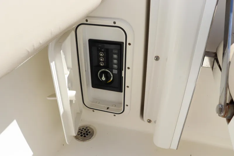 Slide: The Image of Control panel on 2012 Cobia 256 CC boat interior. - 21