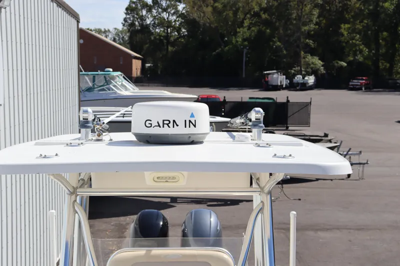 Slide: The Image of 2012 Cobia 256 CC boat with Garmin radar on top. - 27