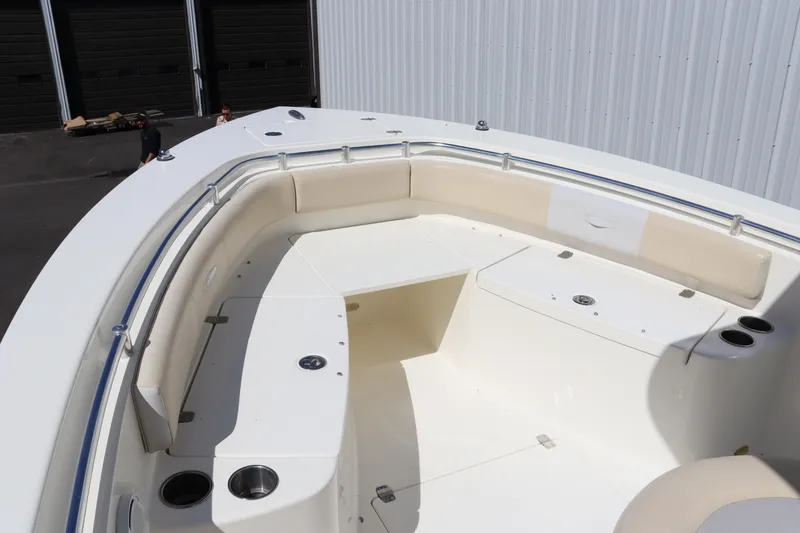 Slide: The Image of 2012 Cobia 256 CC boat with spacious seating and cup holders. - 39