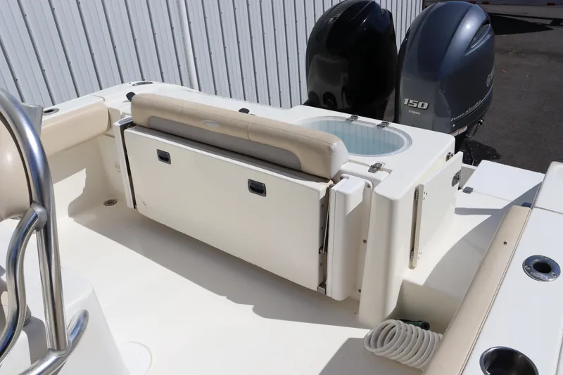 Slide: The Image of 2012 Cobia 256 CC boat with dual engines and seating area. - 42