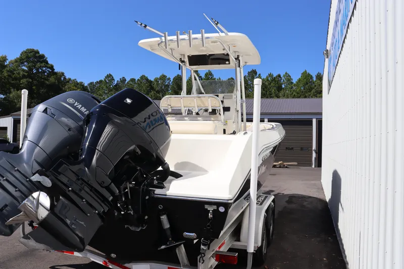 Slide: The Image of 2012 Cobia 256 CC boat with Yamaha outboard motor on trailer. - 6