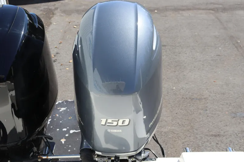 Slide: The Image of Yamaha 150 outboard motor on a 2012 Cobia 256 CC boat. - 9