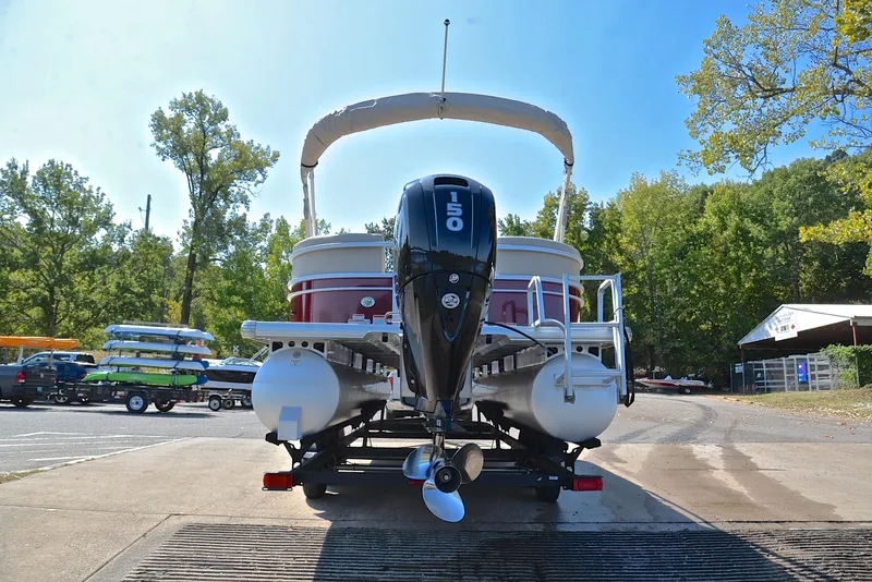 Slide: The Image of 2018 Sun Tracker Party Barge 24 DLX pontoon boat with 150 HP engine at a dock. - 13