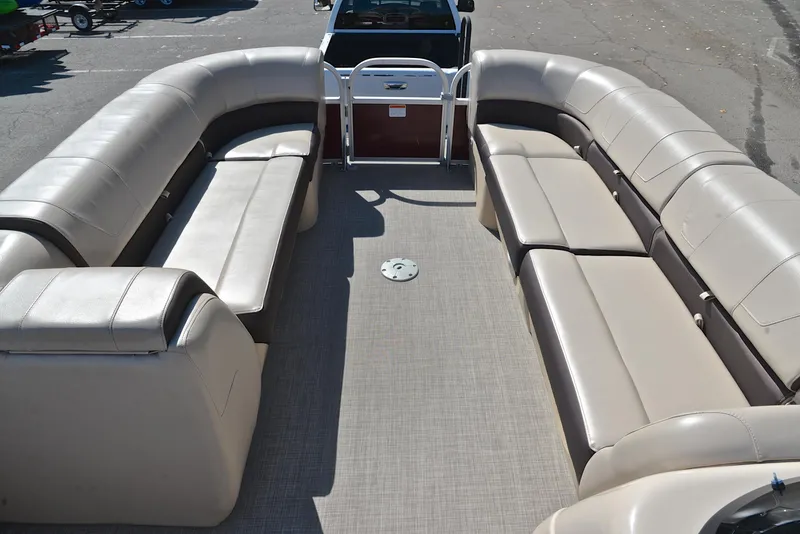 Slide: The Image of 2018 Sun Tracker Party Barge 24 DLX interior with spacious seating and open deck layout. - 21