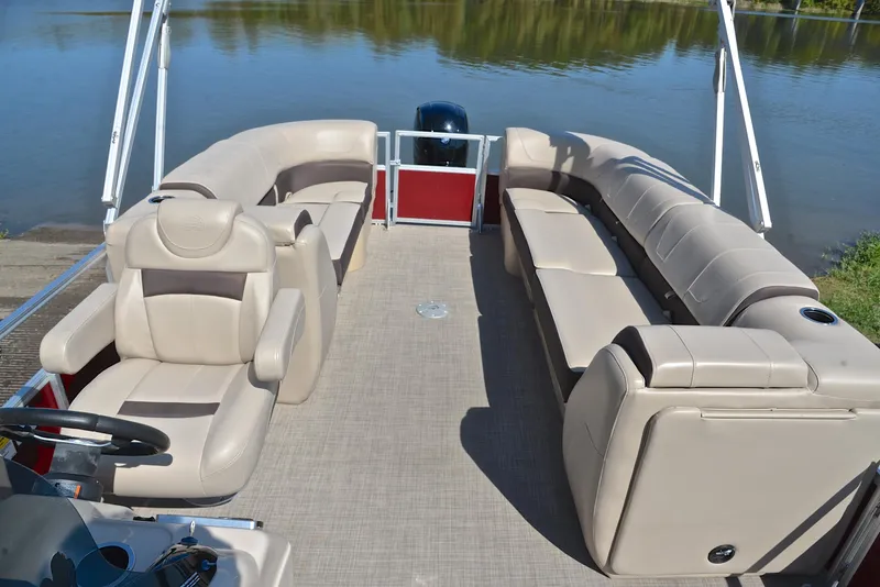 Slide: The Image of 2018 Sun Tracker Party Barge 24 DLX pontoon boat with spacious seating on a calm lake. - 22