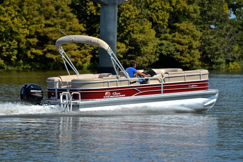 Slide: The Image of 2018 Sun Tracker Party Barge 24 DLX cruising on a lake. - 5