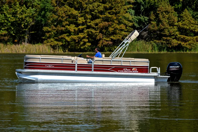 Slide: The Image of 2018 Sun Tracker Party Barge 24 DLX on a serene lake. - 8