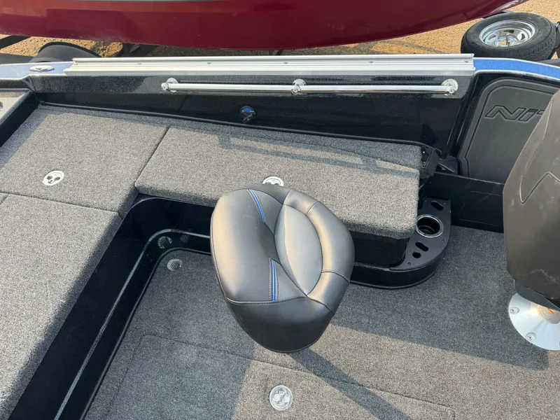 Slide: The Image of 2024 Nitro ZV20 boat interior with cushioned seat and carpeted flooring. - 10