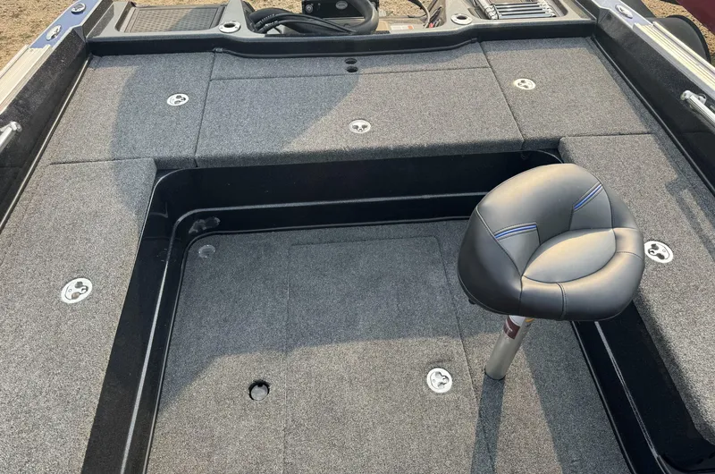 Slide: The Image of 2024 Nitro ZV20 boat interior with gray carpet and adjustable seat. - 11