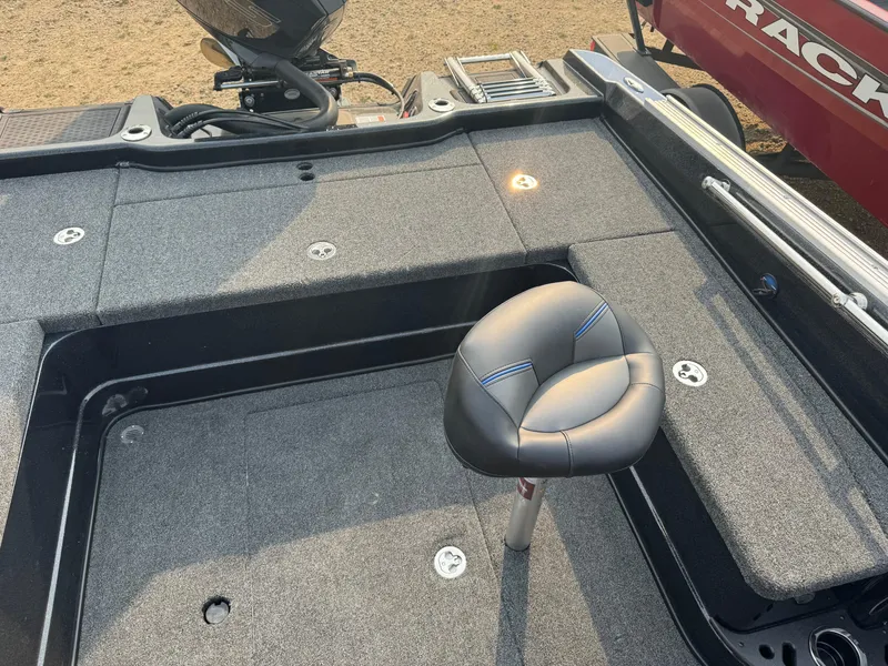 Slide: The Image of 2024 Nitro ZV20 boat deck with cushioned seat and storage compartments. - 14