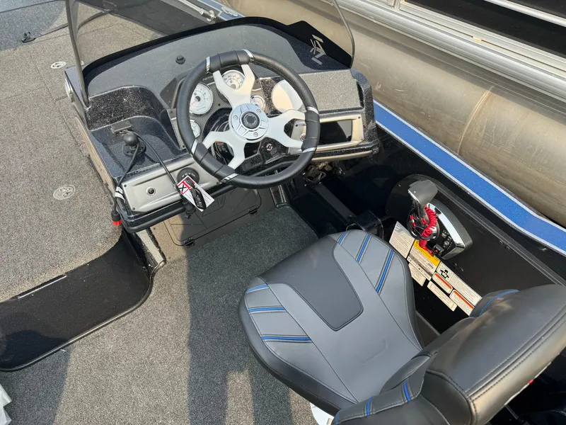 Slide: The Image of 2024 Nitro ZV20 boat cockpit with steering wheel and seat. - 16