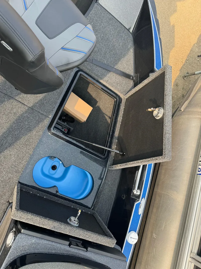 Slide: The Image of 2024 Nitro ZV20 boat interior with storage compartments and blue tank. - 23