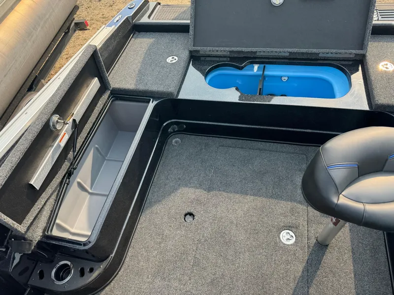 Slide: The Image of 2024 Nitro ZV20 boat interior with storage compartments and seating. - 27