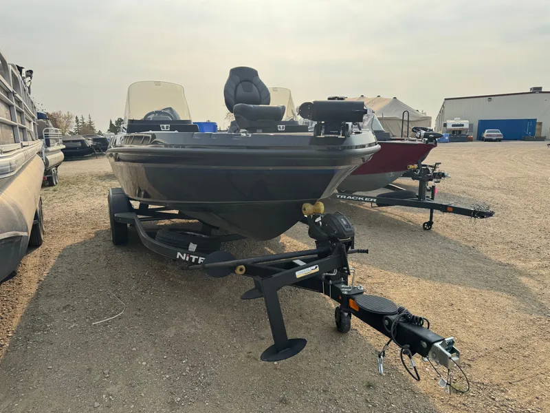 Slide: The Image of 2024 Nitro ZV20 fishing boat on trailer in outdoor lot. - 3