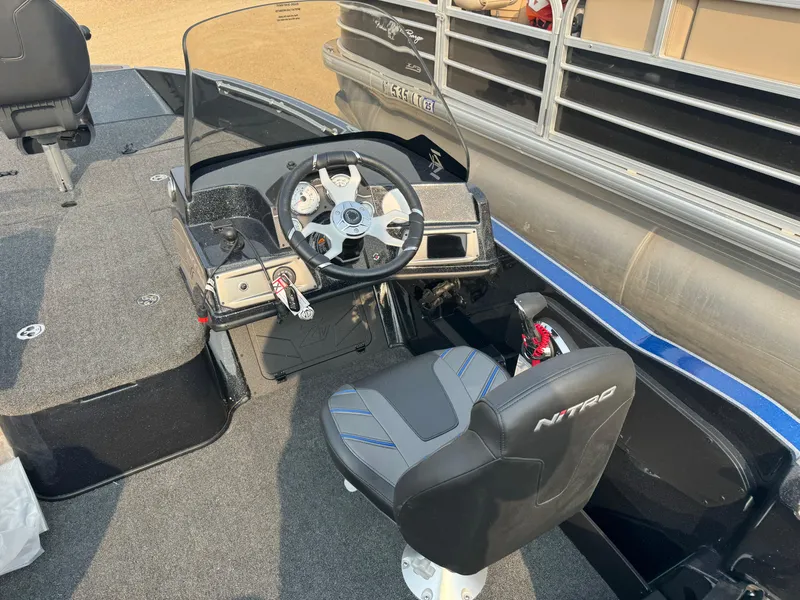 Slide: The Image of 2024 Nitro ZV20 boat cockpit with steering wheel and seat. - 6