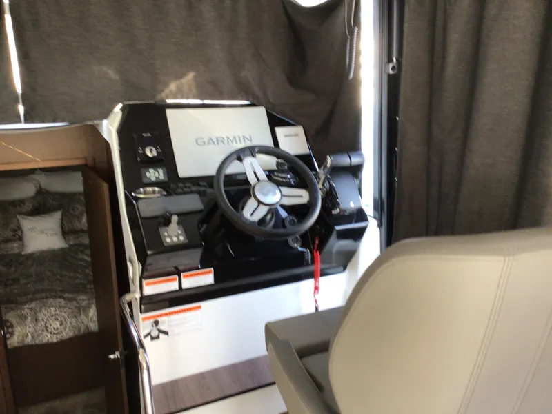 Slide: The Image of 2024 Beneteau Antares 11 Fly helm with Garmin navigation system. - 11