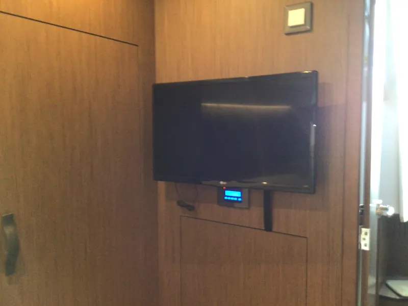 Slide: The Image of Wall-mounted TV in 2024 Beneteau Antares 11 Fly cabin interior. - 17