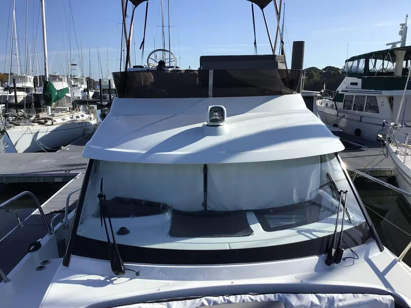Slide: The Image of 2024 Beneteau Antares 11 Fly yacht docked at marina. - 18