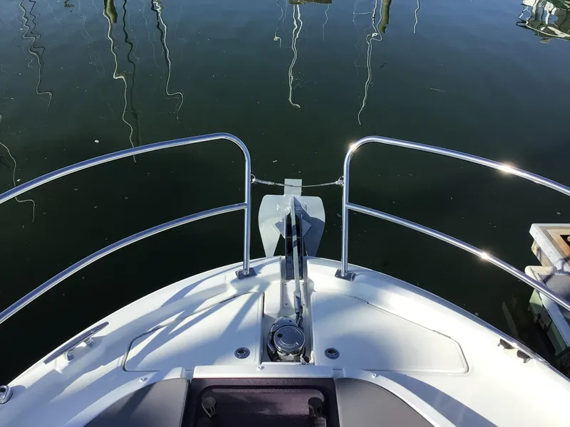 Slide: The Image of 2024 Beneteau Antares 11 Fly bow view with stainless steel railings. - 19