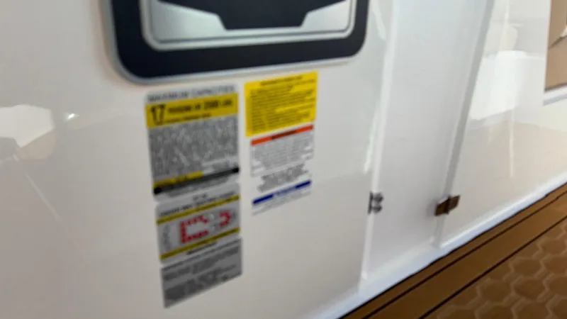 Slide: The Image of Close-up of 2025 MasterCraft XT24 warning labels on white surface. - 14