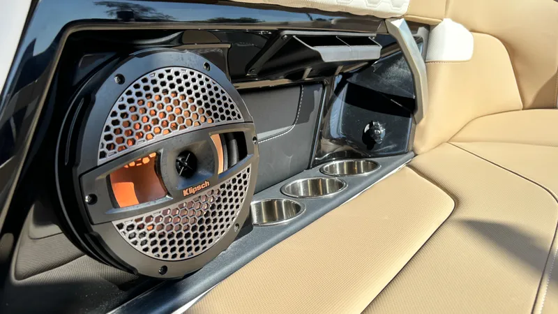Slide: The Image of 2025 MasterCraft XT24 interior with Klipsch speaker and cup holders. - 27