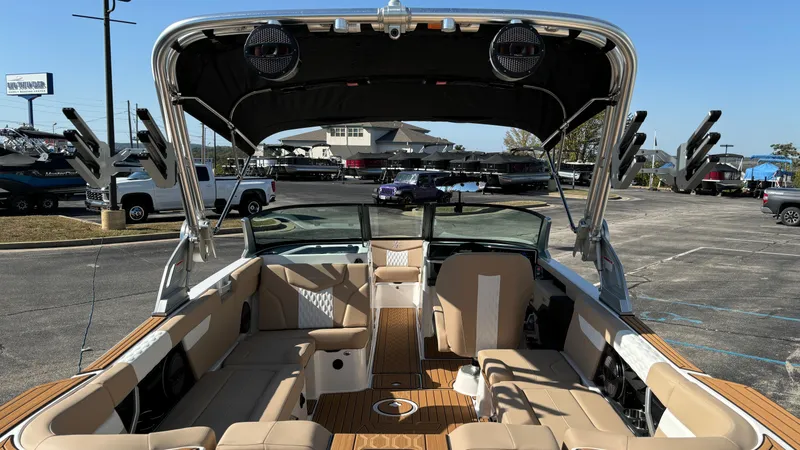 Slide: The Image of 2025 MasterCraft XT24 boat interior with spacious seating and modern design. - 6