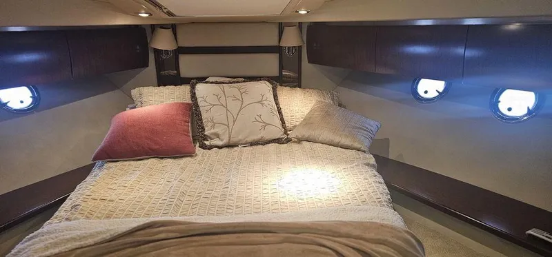 Slide: The Image of Luxurious bedroom interior of 2011 Cruisers Yachts 540 with cozy bedding and ambient lighting. - 18