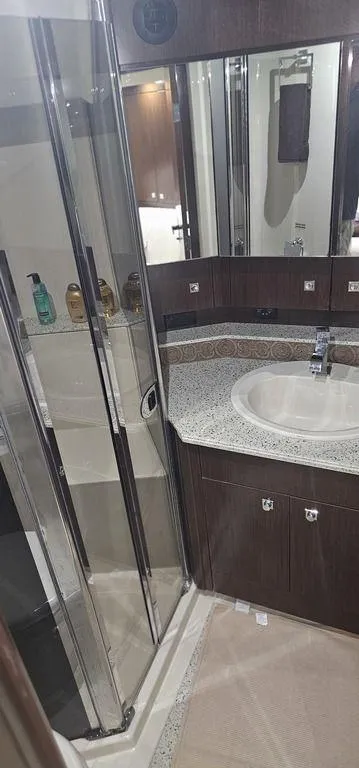 Slide: The Image of Luxurious bathroom in 2011 Cruisers Yachts 540 with modern fixtures and glass shower. - 20