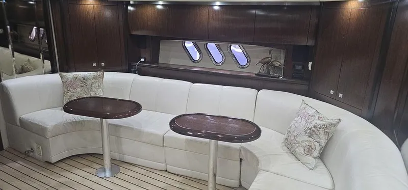 Slide: The Image of Luxurious interior of 2011 Cruisers Yachts 540 with elegant seating and wooden accents. - 21