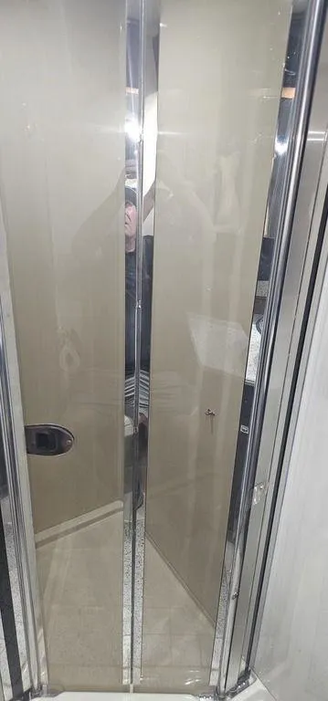 Slide: The Image of Shower enclosure in 2011 Cruisers Yachts 540, featuring sleek glass doors. - 25