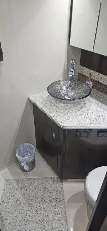 Slide: The Image of Luxurious bathroom in 2011 Cruisers Yachts 540 with modern sink and elegant countertop. - 26