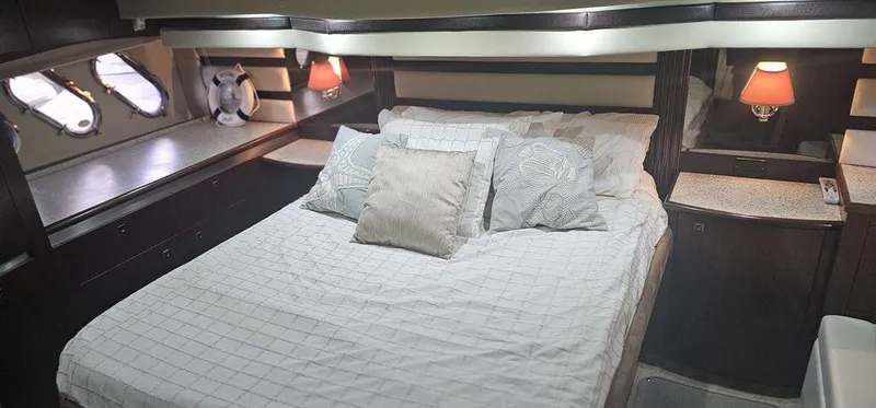 Slide: The Image of Luxurious bedroom interior of 2011 Cruisers Yachts 540 with elegant bedding and ambient lighting. - 27