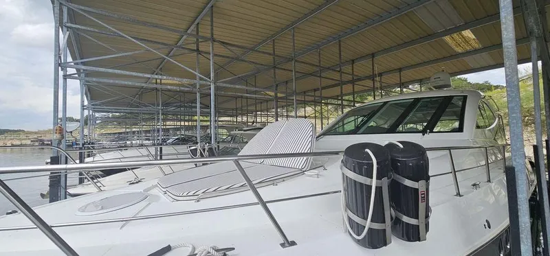 Slide: The Image of 2011 Cruisers Yachts 540 docked under a covered marina. - 5