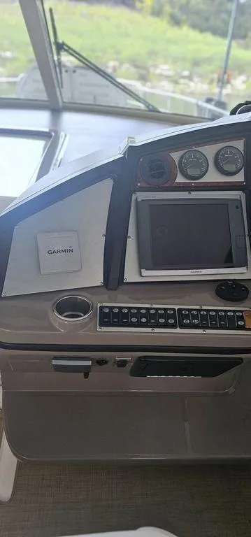 Slide: The Image of 2011 Cruisers Yachts 540 helm with Garmin navigation system and control panel. - 7