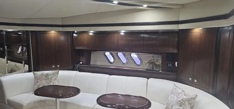 Slide: The Image of Luxurious interior of 2011 Cruisers Yachts 540 with elegant seating and wooden cabinetry. - 22