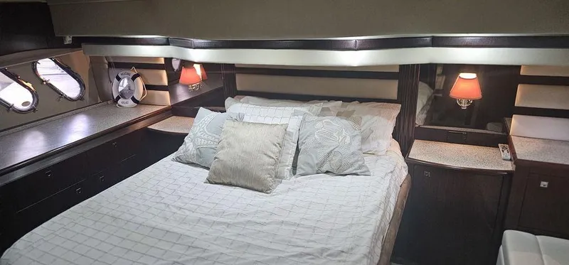 Slide: The Image of Luxurious bedroom interior of 2011 Cruisers Yachts 540 with cozy bedding and ambient lighting. - 30