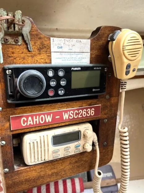 Slide: The Image of 1984 SISU Cuddy boat radio panel with communication devices and microphone. - 3
