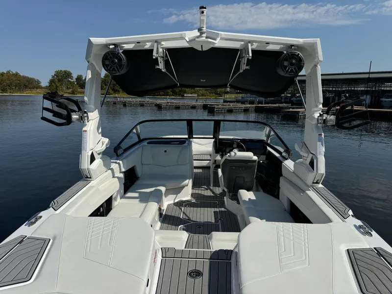 Slide: The Image of 2024 Nautique G23 Coastal Edition boat interior with sleek seating and advanced sound system. - 11