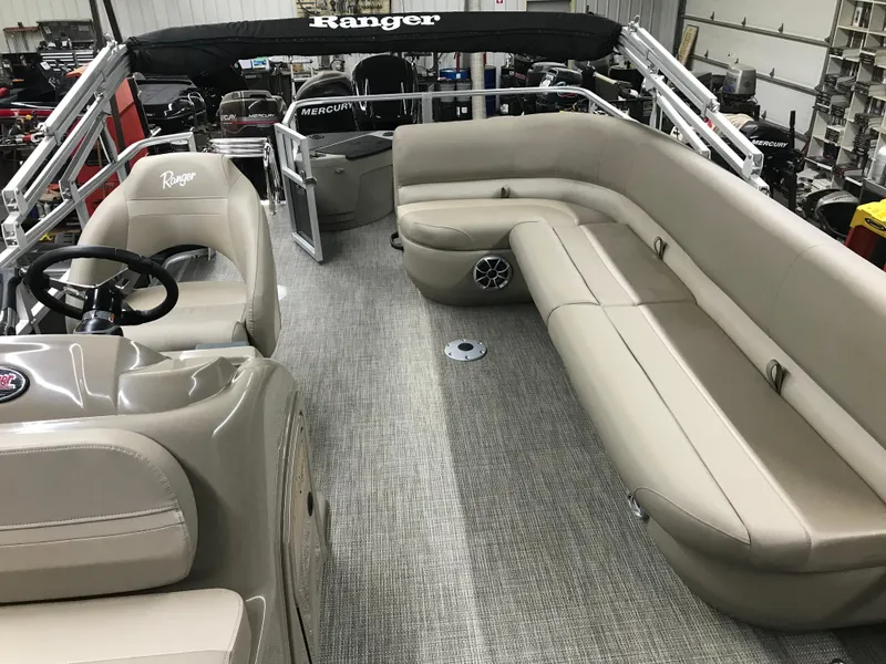 Slide: The Image of 2025 Ranger Reata 200F boat deck with integrated cup holders and measuring board. - 17