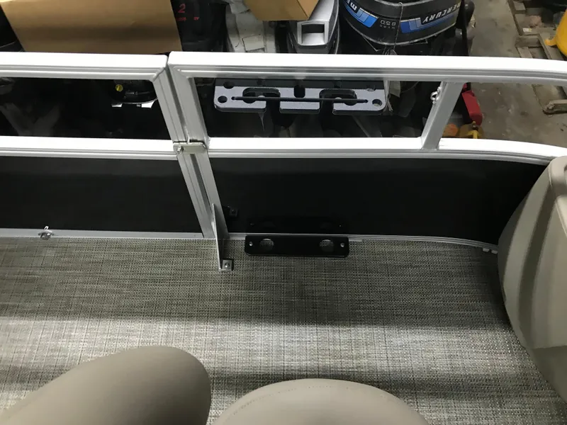 Slide: The Image of 2025 Ranger Reata 200F boat interior with beige seating and steering wheel. - 19