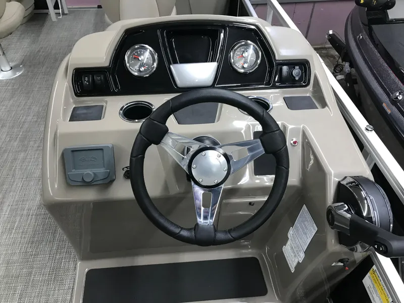 Slide: The Image of 2025 Ranger Reata 200F boat interior with steering console and seating. - 22