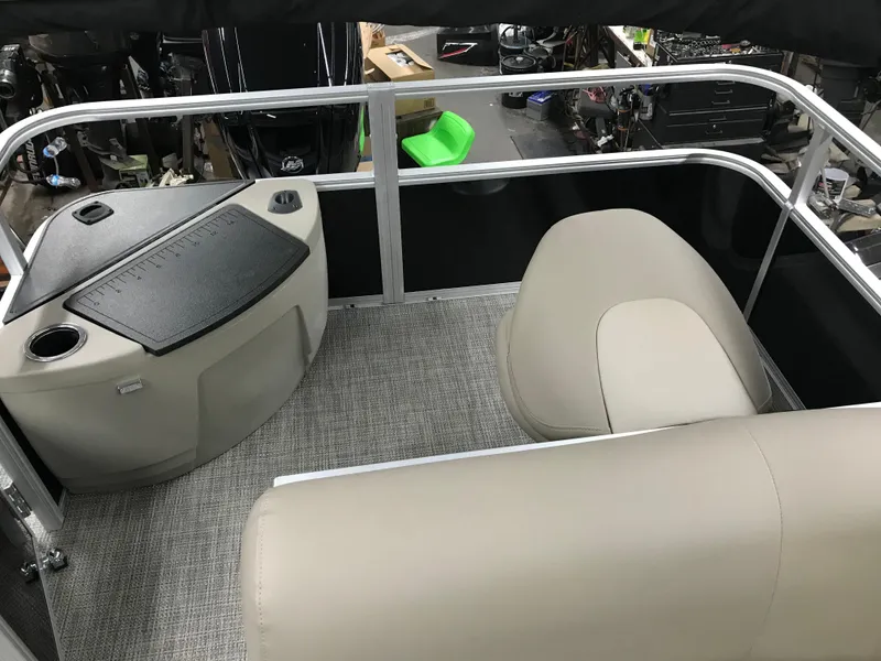 Slide: The Image of 2025 Ranger Reata 200F boat interior with open gate and seating area. - 25