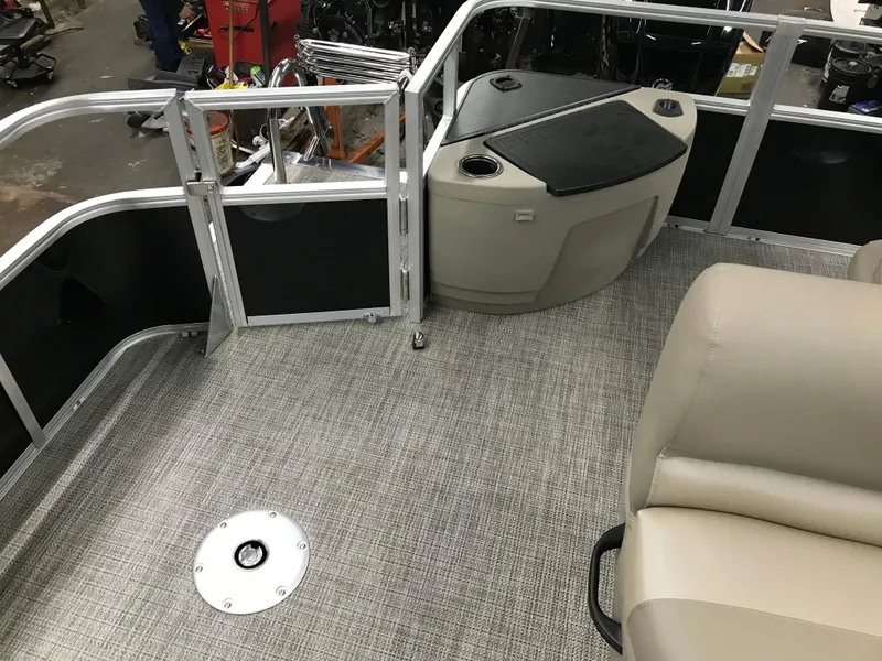 Slide: The Image of 2025 Ranger Reata 200F boat seat with gray upholstery and cup holders. - 27