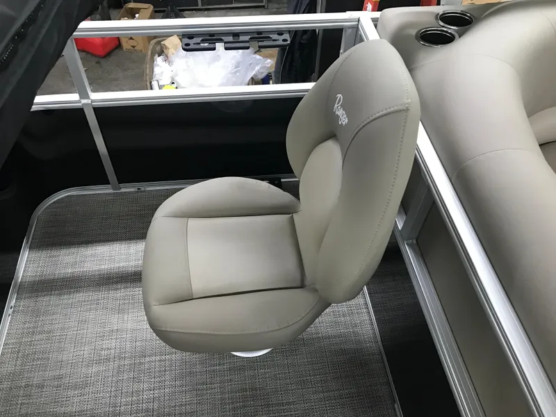 Slide: The Image of 2025 Ranger Reata 200F boat interior with branded cover and seating area. - 28