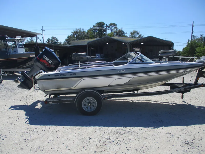 Slide: The Image of 2008 Skeeter 190 SKI FISH SL190 boat on trailer, outdoors. - 3