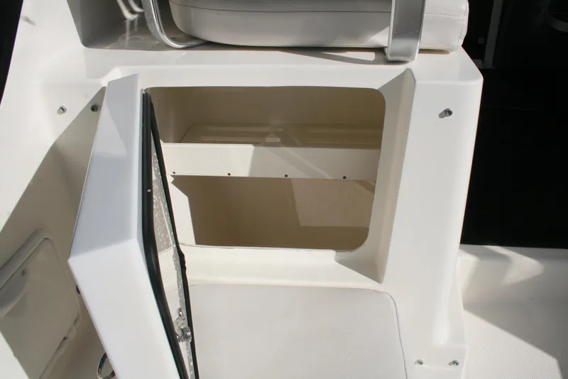 Slide: The Image of Open storage compartment on 2005 Pursuit 3370 Offshore boat. - 6