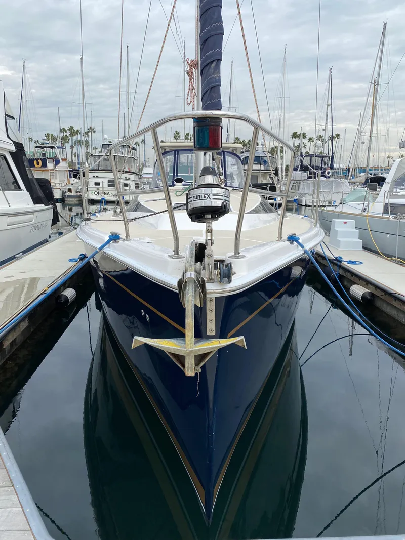 Slide: The Image of 2014 Marlow Hunter 40 sailboat docked in marina, front view. - 13