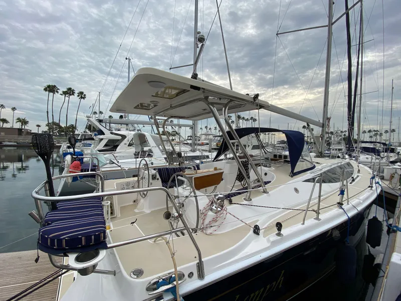Slide: The Image of 2014 Marlow Hunter 40 sailboat docked in marina, overcast sky. - 19