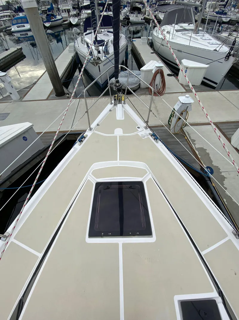 Slide: The Image of 2014 Marlow Hunter 40 sailboat docked at marina, view from bow. - 22